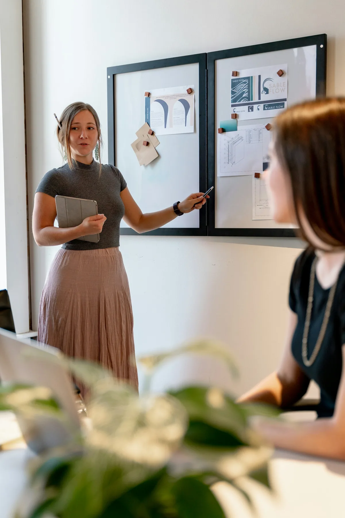 Workplace scene illustrating Managers Should Not Have to Be the Workflow